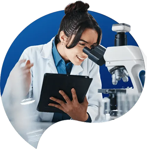 Biotech scientist using microscope